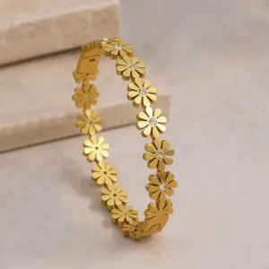 gold plated floral bangle style bracelet