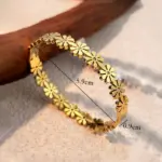 gold plated floral bangle style bracelet